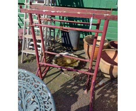 A pair of industrial metal props