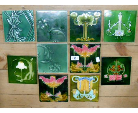 Ten Victorian dust-pressed ceramic tiles with various Art Nouveau floral designs