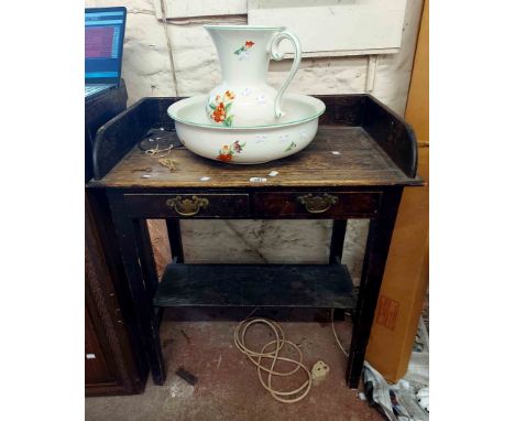 A 76cm antique stained pine washstand with raised back and two frieze drawers, set on square tapered supports with undertier 