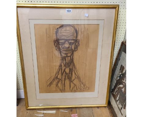 A gilt framed charcoal sketch portrait of a man, on buff paper - indistinctly signed - 53cm X 45cm
