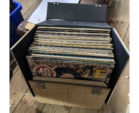 A case containing a quantity of vintage LP records including Elvis 40 Greatest Hits special pink pressing edition, The Best o