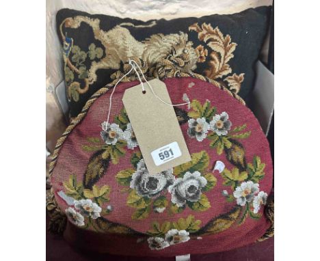 An antique beaded tea cozy - sold with a black tapestry cushion, depicting a heraldic lion and horse
