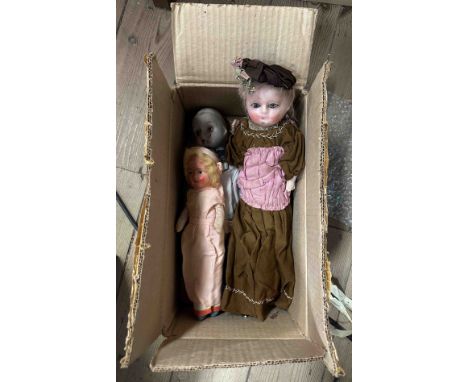 Three collectable dolls comprising, an antique French bisque headed doll, a plastic headed vintage doll in pink silk dress an