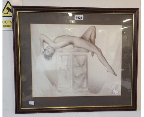 A framed vintage monochrome print depicting a nude female dancer