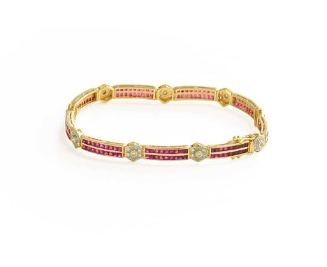 A Ruby and Diamond Bracelet, double rows of calibré cut rubies spaced by round brilliant cut diamond clusters, in yellow chan