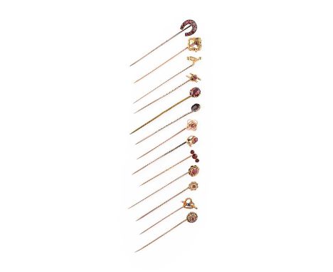Thirteen Gem-Set Stick Pins, of varying designs, set throughout with garnet, ruby, sapphire etcProvenance: Private collection