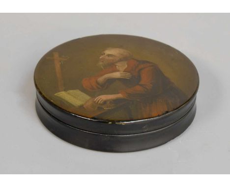 A Lacquered Papier Mache Table Snuff Box, 19th century, painted to the cover with a portrait of St Jerome, 12cm diameter