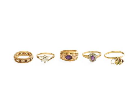Five 9 Carat Gold Dress Rings, including an amethyst and diamond cluster ring, finger size R; an amethyst ring, finger size K