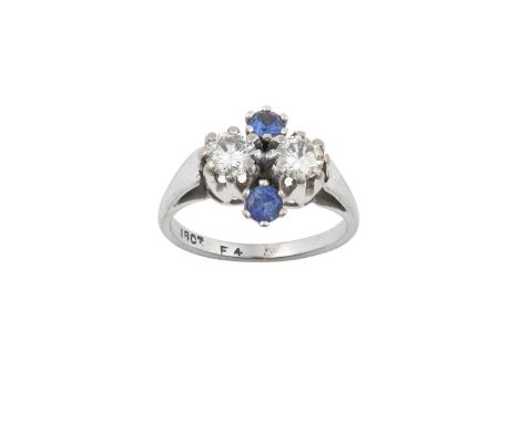 A Blue Stone and Diamond Ring, a cluster formed of two round brilliant cut diamonds alternating with round cut blue stones, i