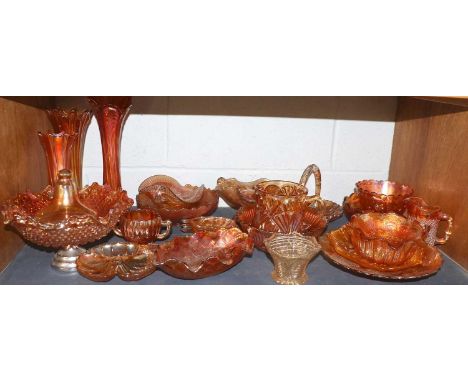 A Collection of Carnival Glass Including: pedestal vases, jugs, etc (one shelf)