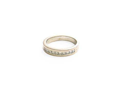 A Diamond Half Hoop Ring, the princess cut diamonds in white channel settings, to a plain polished shank, total estimated dia