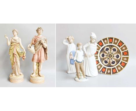 Two Royal Dux Figures, numbered 211 and 212, two Nao figures, another ceramic figure and a Royal Crown Derby PlateDerby plate