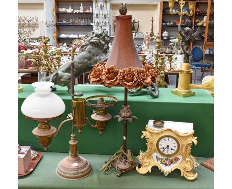 A Victorian Twin Oil Lamp, a reproduction table lamp, a French porcelain striking mantle clock, and a ceiling fitment