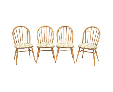 Set of four Ercol beech and elm hoop back kitchen chairs, loose cushions, height 90cm.Qty: 4Condition report:All four chairs 