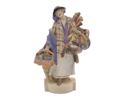 Staffordshire earthenware figure, S K Cope, Burslem, in the style of Charles Vyse, modelled as a World's End street vendor, 2