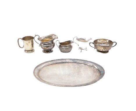 Silve tray, makers mark worn, Chester 1924, oval, engine turned, 30cm, three silver cream jugs, silver mug, silver two handle
