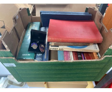 A box of Vintage nursing books along with nursing silver hall marked badge with enamel badge 