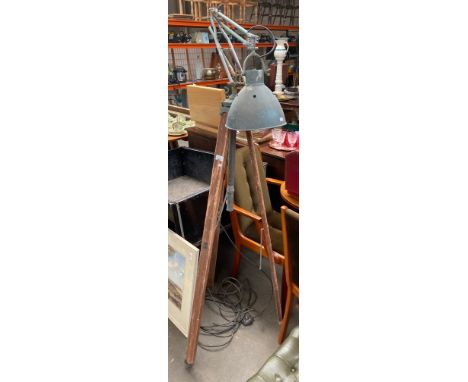 An Antique industrial Angle poised Lamp on tri pod supports 