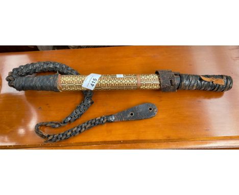 An Antique Indian Whip with hidden blade with a Parquetry design shaft and leather handle 
