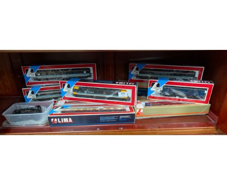 A Shelf of boxed lima train models includes Scotrail loco &amp; carriages 