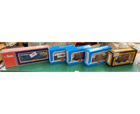 A Boxed Lima Diesel loco along with 4 boxed wagons 
