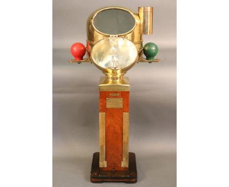 Ships Binnacle by Kelvin Hughes Highly polished brass ships binnacle with  varnished pedestal base. The binnacle housing has 