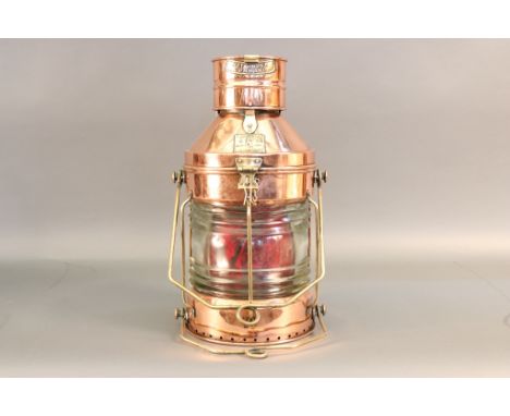 Solid Copper and Brass Anchor Lantern Highly polished copper and brass ship's anchor  lantern with fresnel glass lens. Carry 