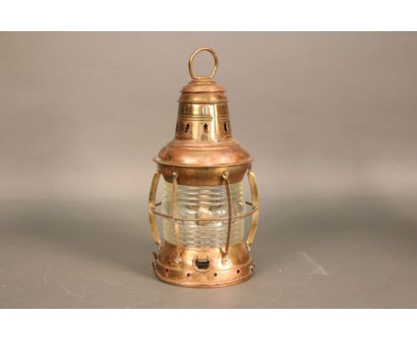 Solid Brass Ship's Anchor Lantern Solid brass ship's anchor lantern with fresnel  glass lens, protective cage, hanging ring. 