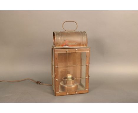 Solid Copper Ships Cabin Lantern Solid copper ships cabin lantern with electrical  socket, protective cage, and hinged door. 