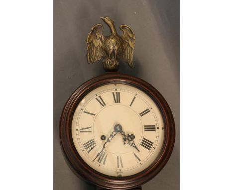 Antique Clock Mahogany wall clock with eagle finial, reverse  painted glass panels. Dimensions: 37" tall x 12"  wide. 