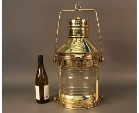 Solid Brass Ship's Anchor Lantern Brass ship's anchor lantern with fresnel glass  lens, hinged top with hasp, vented cap. Car