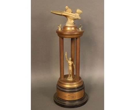 Speedboat Trophy Powerboat trophy with speedboat finial and Roman  athlete standing between three columns.  Engraved  Y. C. S
