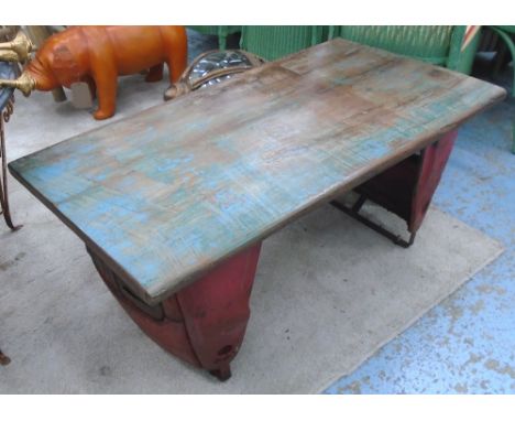LOW TABLE, with wooden rectangular top on tractor part base, 111cm x 59cm x 48cm H. 