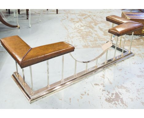 CLUB FENDER, Traditional studded leather seats raised on shaped silvered metal balustrade, 182cm W x 57cm D x 49cm H.