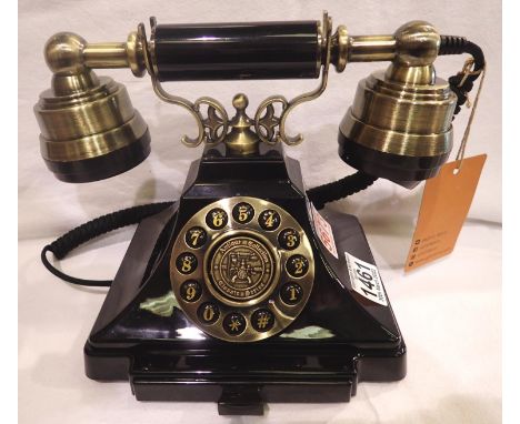 The Duke is a push button telephone with a black &amp; brass finish and traditional cloth handset curly cord. Compatible with