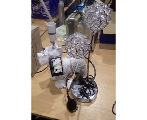 Two lamps lamps to include a Scotty dog example, H: 44 cm. Not available for in-house P&P, contact Paul O'Hea at Mailboxes on