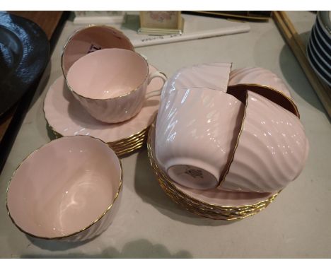 Minton, a part tea service, pink ground with gilt highlights (19), all pieces with signs of use but no cracks, chips or visib