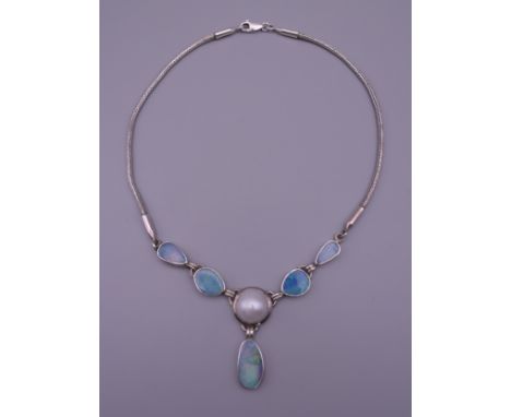 An opal set silver necklace. 