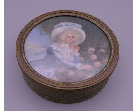 A 19th century French embossed brass box, the lid inset with a painted portrait miniature on ivory of a young lady picking ro