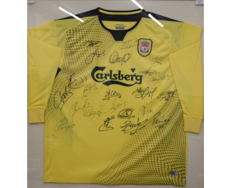 A Liverpool away football shirt signed by: Jerzy Dudek (1), Steve Finnan (3), Jamie Carragher (23), Sami Hypia (4), Dijmi Tra