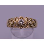 A 15 ct gold and diamond ring. Ring size V/W. 6.1 grammes total weight.