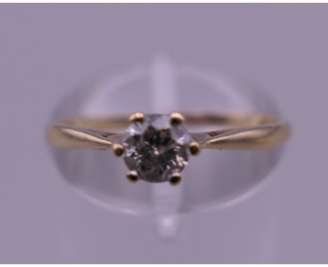 A 9 K gold 0.25 carat diamond solitaire ring. Ring size M. 1.1 grammes total weight.