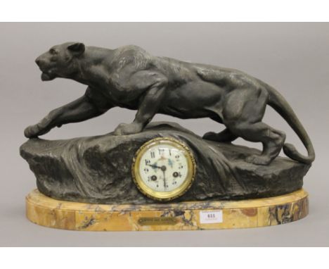 A 19th century French spelter mantle clock mounted on a marble plinth base, bearing label inscribed 'Lionne Aux Aguets Par Bo