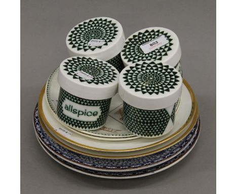 Six porcelain plates and four Poole pottery herb storage pots. The pots 7.5 cm high.