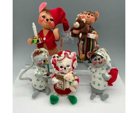 Delightful collection of holiday animals in their pajamas that includes a mouse with a red jacket and a light up candle, a mo
