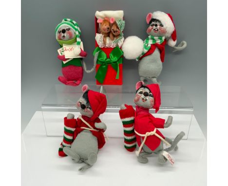 Charming collection of holiday animals that includes two mice modeling red jackets while holding stockings, a mouse with a sc