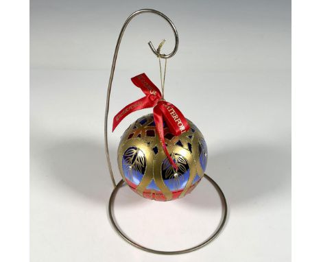 Handcrafted glass bauble features a stunning peacock inspired design, with gold ribbons resembling a feather tail, elegantly 