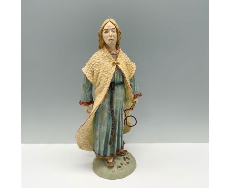 A blonde woman in a blue dress and yellow robe stands in a powerful pose, confidently holding a whip in her hand. Issued: 198