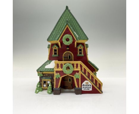 This hand painted porcelain figurine is Santa's Rooming House and comes with light kit. This item has its original box that m
