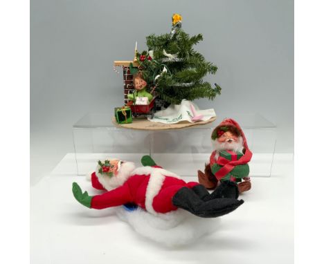 Adorable collection of figures that includes a child under a battery operated light up Christmas tree that is signed by Chuck